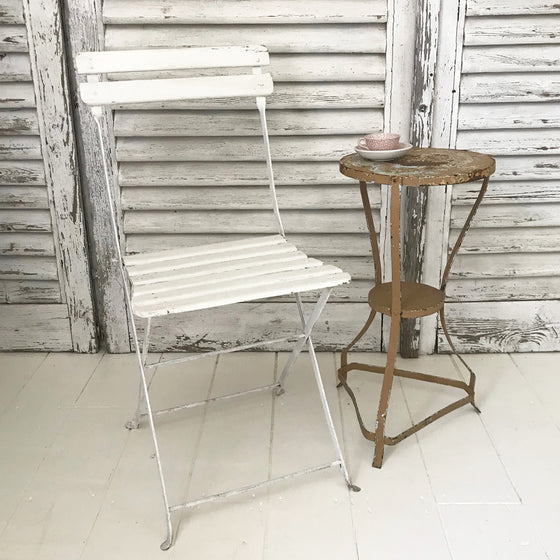 Folding white French cafe chair
